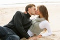Portrait Of Romantic Young Couple Kissing On Beach Royalty Free Stock Photo