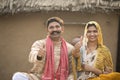 Portrait of rural couple gesturing thumbs up