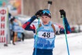 Portrait Russian sportsman biathlete Hmara Yaroslav Saint Petersburg at finish after rifle shooting and skiing. Youth
