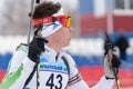 Portrait Russian sportsman biathlete Zlobin Vladislav Khanty-Mansiysk at finish after rifle shooting and skiing. Junior