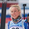 Portrait Russian sportswoman biathlete Kseniya Petrunova (Kamchatka) at finish after skiing and rifle shooting