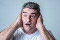 Concern scared shocked adult man with a terrified facial expression Royalty Free Stock Photo