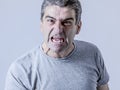 portrait of 40s to 50s white angry and upset guy and crazy furious and aggressive face expression nagging and complaining Royalty Free Stock Photo