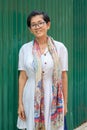 Portrait of 45s years asian woman standing with toothy smiling f