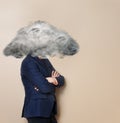 Portrait of sad angry man with suit head in cloud