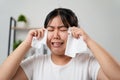 Portrait of a Sad Asian woman crying wipes her tears with a tissue paper towel