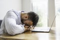 Portrait of a sad and depress mexican businessman working at modern home office with computer laptop Royalty Free Stock Photo