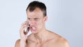 Portrait of sad desperate angry man talking on phone and yelling Royalty Free Stock Photo