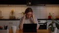 Portrait of a sad girl feeling tired, sitting at home in the kitchen. The girl got bad news Royalty Free Stock Photo