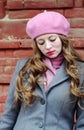Portrait of a sad girl in a pink beret Royalty Free Stock Photo
