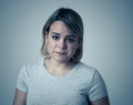 Portrait of sad and intimidated woman. Isolated in white background. Human expressions and emotions Royalty Free Stock Photo