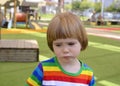 Portrait of a sad little boy in playground Royalty Free Stock Photo