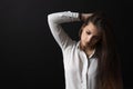 Portrait of sad long haired girl posing in studio Royalty Free Stock Photo