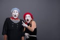 Portrait of sad mime couple crying isolated on Royalty Free Stock Photo