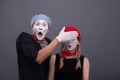 Portrait of sad mime couple crying isolated on