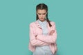 Sad offended teenager girl standing with hand down, being in bad mood, arguing with somebody Royalty Free Stock Photo