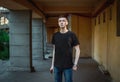 Portrait of sad and pensive handsome young man standing near old building Royalty Free Stock Photo