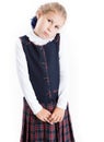 Portrait of sad primary school girl dressed school uniform, isolated on white background Royalty Free Stock Photo