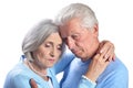 Portrait of sad senior couple hugging on white background Royalty Free Stock Photo