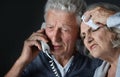 Portrait of sad senior couple portrait with phone Royalty Free Stock Photo