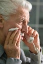 Portrait of sad sick senior man calling doctor Royalty Free Stock Photo