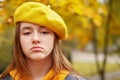 Portrait of sad teen girl in yellow beret. Royalty Free Stock Photo