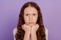 Portrait of sad unhappy grumpy little lady fists chin frustrated look camera on purple background