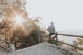 Portrait of a Sad or unhappy man sitting on a railing at Sunset Royalty Free Stock Photo