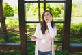 Portrait of sad upset shocked woman wearing light casual clothes. Pretty girl holding tablet pc computer, reading fake Royalty Free Stock Photo