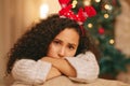 Portrait, sad woman and depression on Christmas in home with anxiety, worry and emotional crisis. Face of lonely female Royalty Free Stock Photo