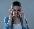 Portrait of sad woman in pain having headache and migraines Royalty Free Stock Photo