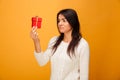 Portrait of a sad young woman holding small gift box Royalty Free Stock Photo