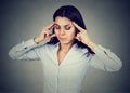 Portrait of a sad young woman with worried stressed face expression having headache Royalty Free Stock Photo