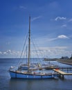 Portrait of a sailboat at a wooden pier. Germany, Baltic Sea