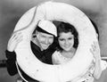 Portrait of sailor and sweetheart with life preserver Royalty Free Stock Photo