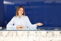 Portrait of saleswoman near showcase in jewelry store