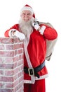 Portrait of santa claus carrying bag full of gifts Royalty Free Stock Photo