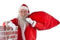 Portrait of santa claus carrying bag full of gifts Royalty Free Stock Photo