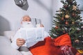 Santa claus reading newspaper Royalty Free Stock Photo