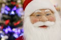Portrait Santa Claus face with glasses and red hat