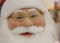 Portrait Santa Claus face with glasses and red hat