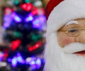 Portrait Santa Claus face with glasses and red hat