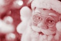 Portrait Santa Claus face in glasses, red tone