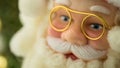 Portrait Santa Claus face in gold glasses, closeup toy