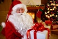 Portrait Santa Claus with gift for you Royalty Free Stock Photo