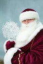 Portrait of Santa Claus on a gray background.