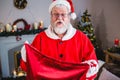 Santa claus holding gift sack at home Royalty Free Stock Photo