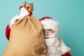 Santa holding a sack filled with presents