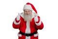 Portrait of Santa giving thumbs up gesture. Royalty Free Stock Photo