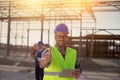 Engineer with thumb up on building site